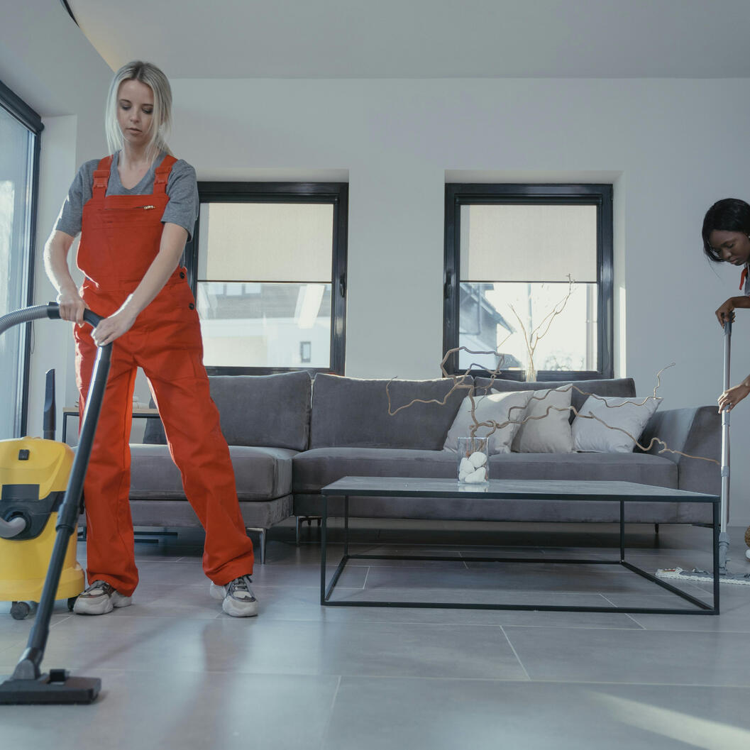 Pinks home service team staff cleaning interior window